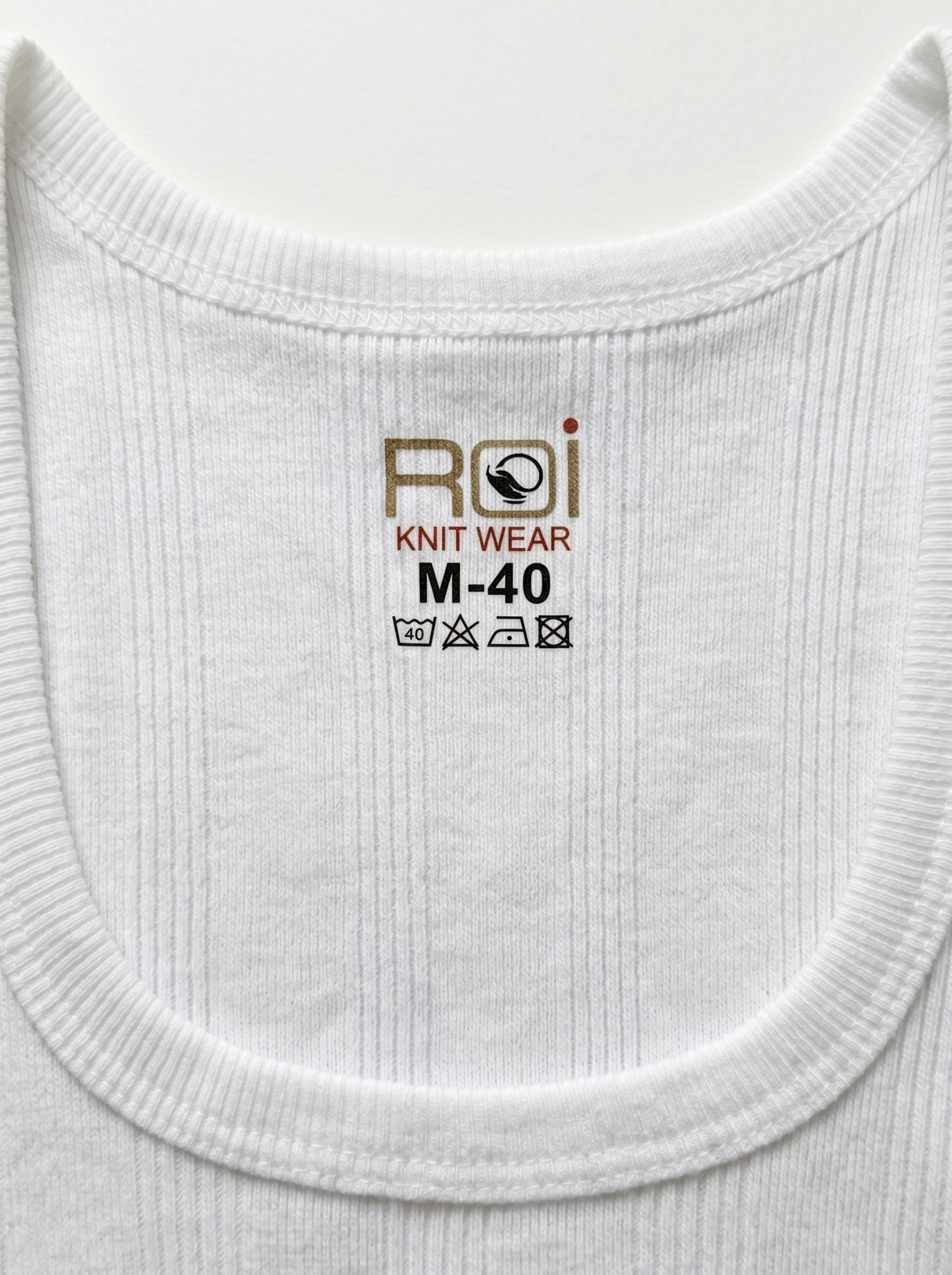 RIB vest neckline and label detail